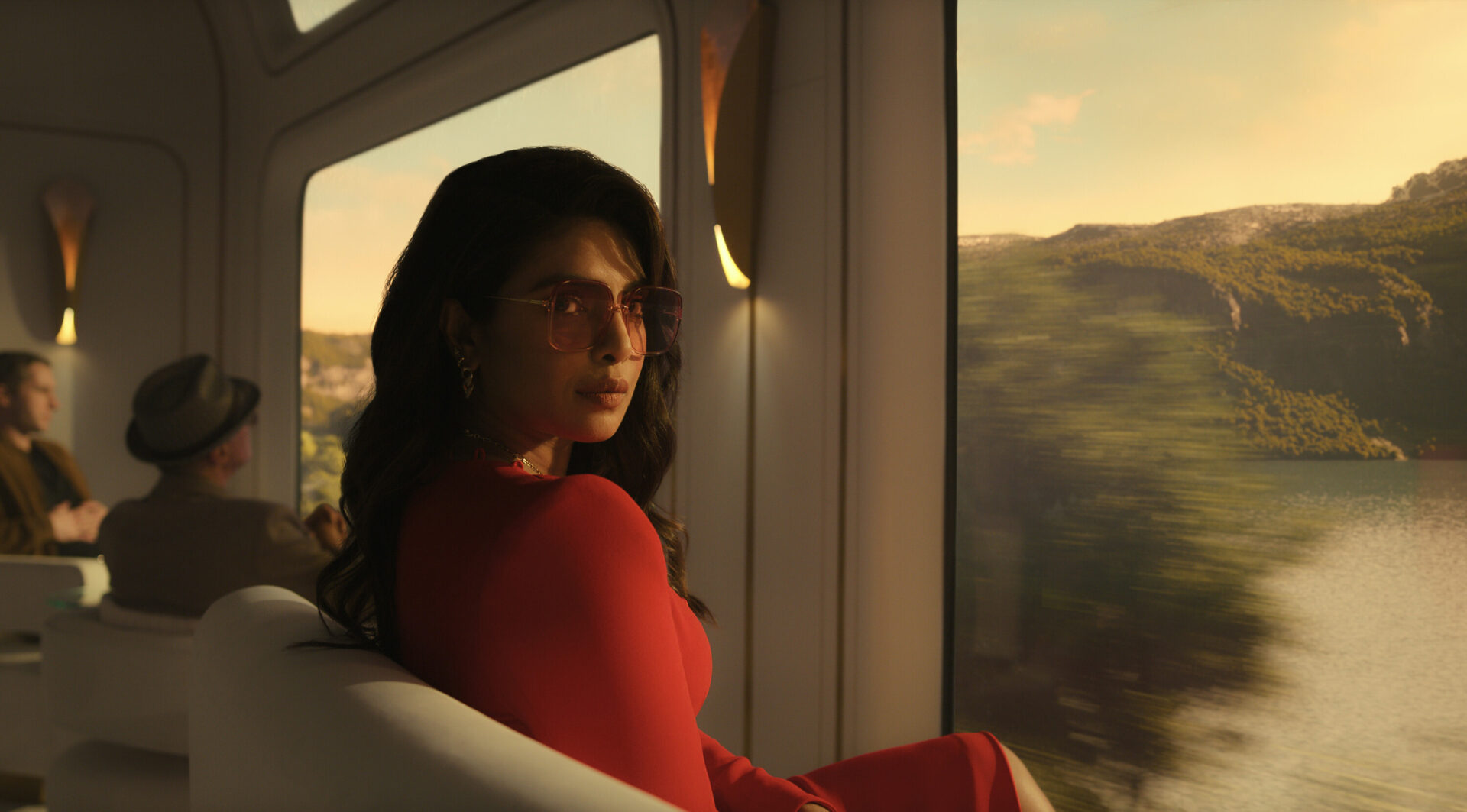 Nadia on the train in Italy as they try to stop a seller carrying uranium.