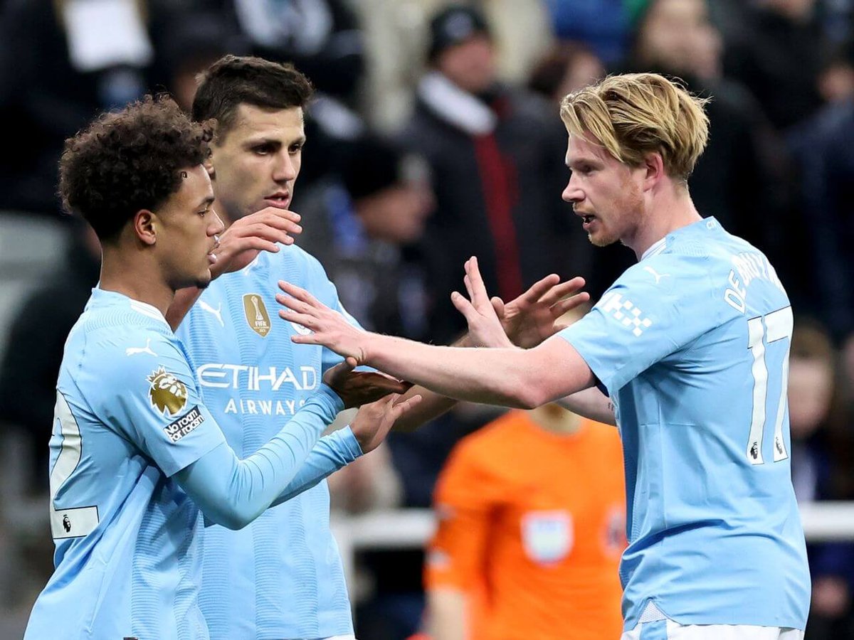 Clash of the Titans: Man United Draw Tottenham as Man City Beat Newcastle in Premier League Matchday 21 Results 4 | Mania Africa | maniainc.com Kevin De Bruyne and Oscar Bobb celebrating their goals against Newcastle | EPL Matchday 21 Results | Man City v Newcastle | Mania Africa