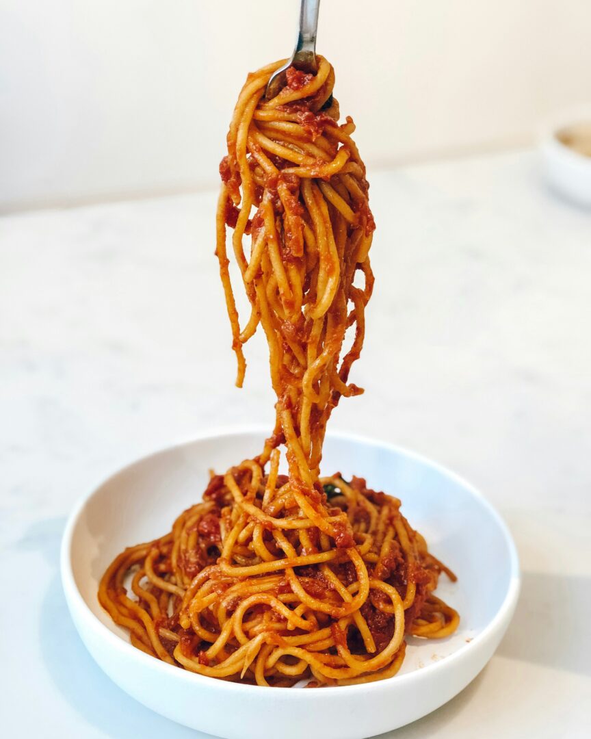 Untangling Clumped Up Spaghetti: A Step-by-Step Guide for Perfectly Separated Strands 2 | Mania Africa | maniainc.com pasta dish on white ceramic bowl | Identifying Clumped Spaghetti