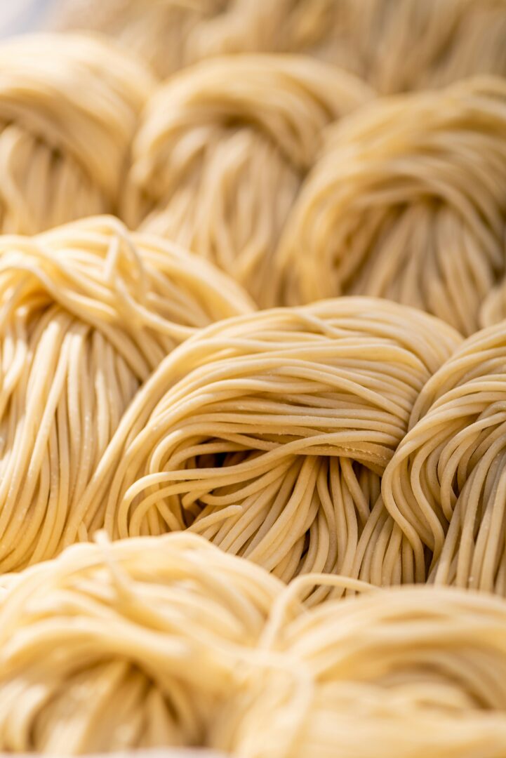 Untangling Clumped Up Spaghetti: A Step-by-Step Guide for Perfectly Separated Strands 3 | Mania Africa | maniainc.com spaghetti on white ceramic plate | How to Untangle Clumped Up Spaghetti | Mania Lifestyle