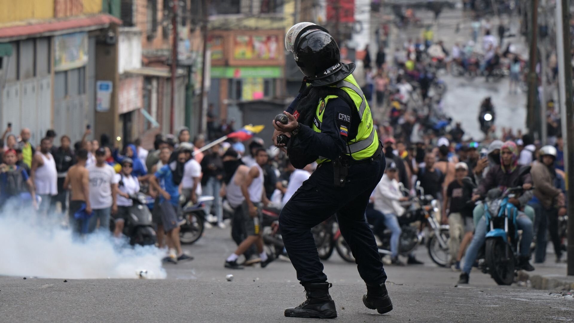 The Fall of Nicolas Maduro? Unrest Erupts in Venezuela Following Maduro's Re-Election 13 | Mania Africa | maniainc.com A Venezuelan police officer lobbying tear gas against protestors in Caracas on Tuesday | Unrest and the Future of Venezuela: Is this the Fall of Nicolas Maduro? | Mania Africa